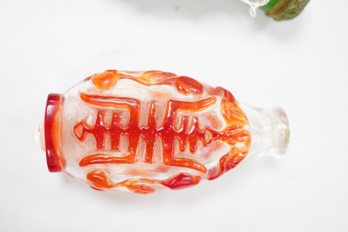 Three Chinese glass snuff bottles and a porcelain snuff bottle(4), tallest 8cm high
